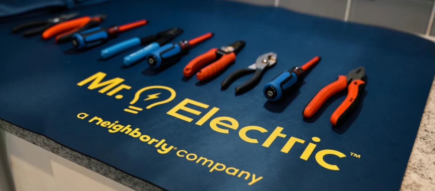Mr. Electric tool mat resting on countertop.
