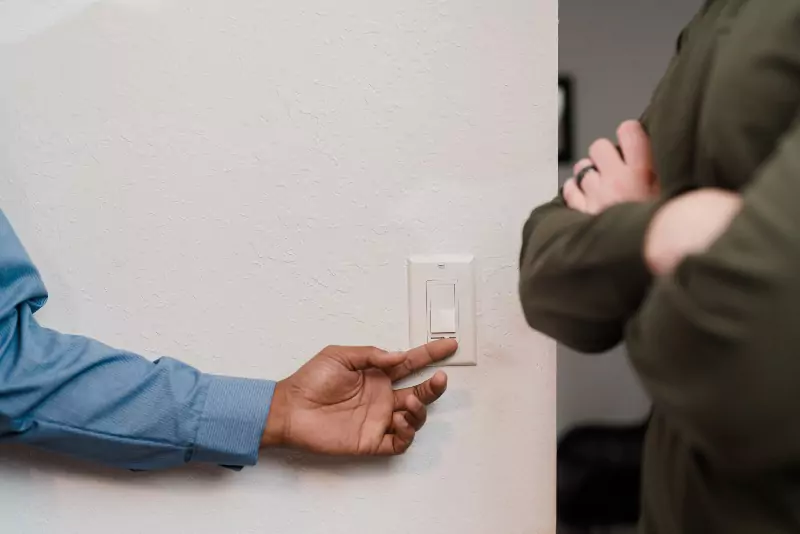A Mr. Electric electrician testing out a light dimmer.